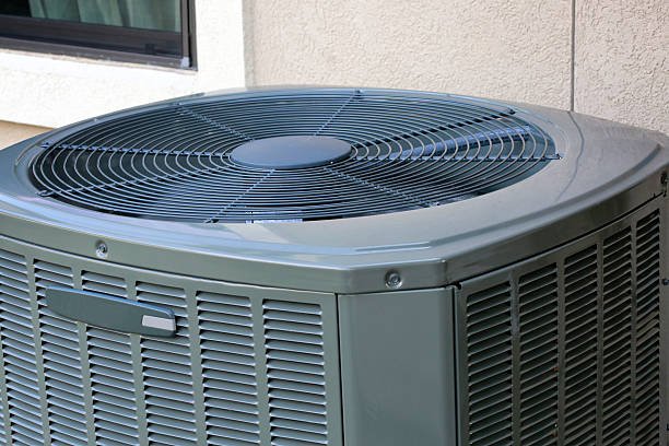 Exterior view of a Goodman ac unit positioned beside a building, designed for efficient temperature control.