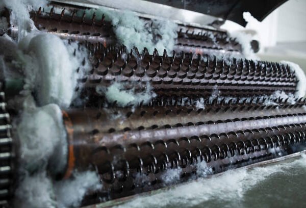 HVAC unit filled with water and foam, showcasing its cooling mechanism in action.