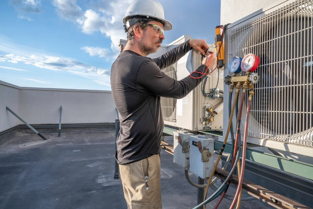 Air conditioning contractor testing airflow in home