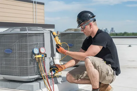 Air filter replacement during preventive HVAC maintenance service