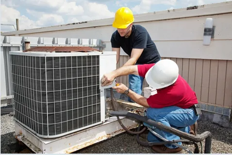 air conditioning repair company technician inspecting AC unit breakdown