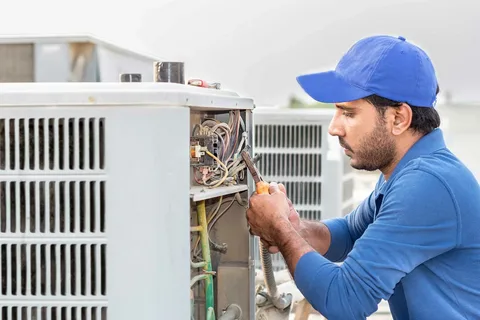 Emergency AC repair service diagnosing AC system failure in home