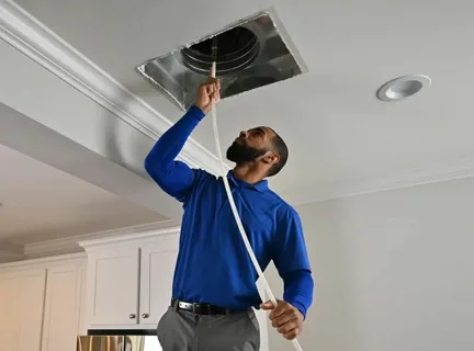 Contractor installing galvanized sheet metal ventilation ducts and air vents for an efficient Duct Installation project